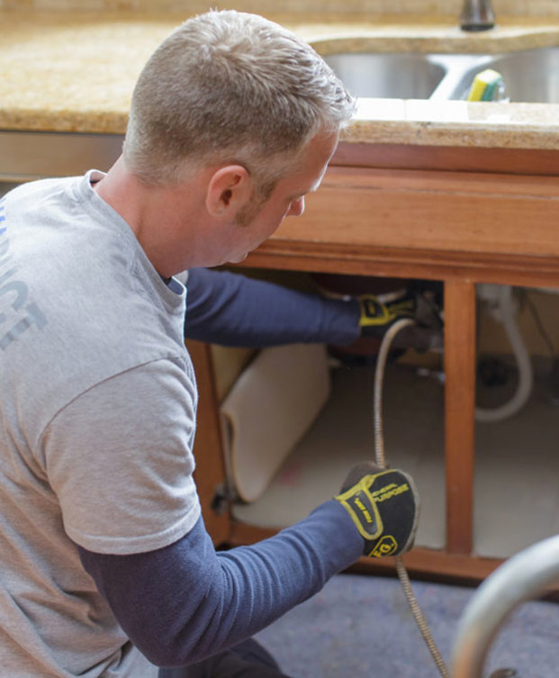 Snaking out pipe under sink